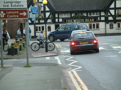 Cyclists on a zebra crossing