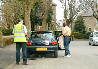 Examiner checking the car