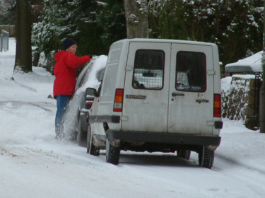 Clearing snow off the car